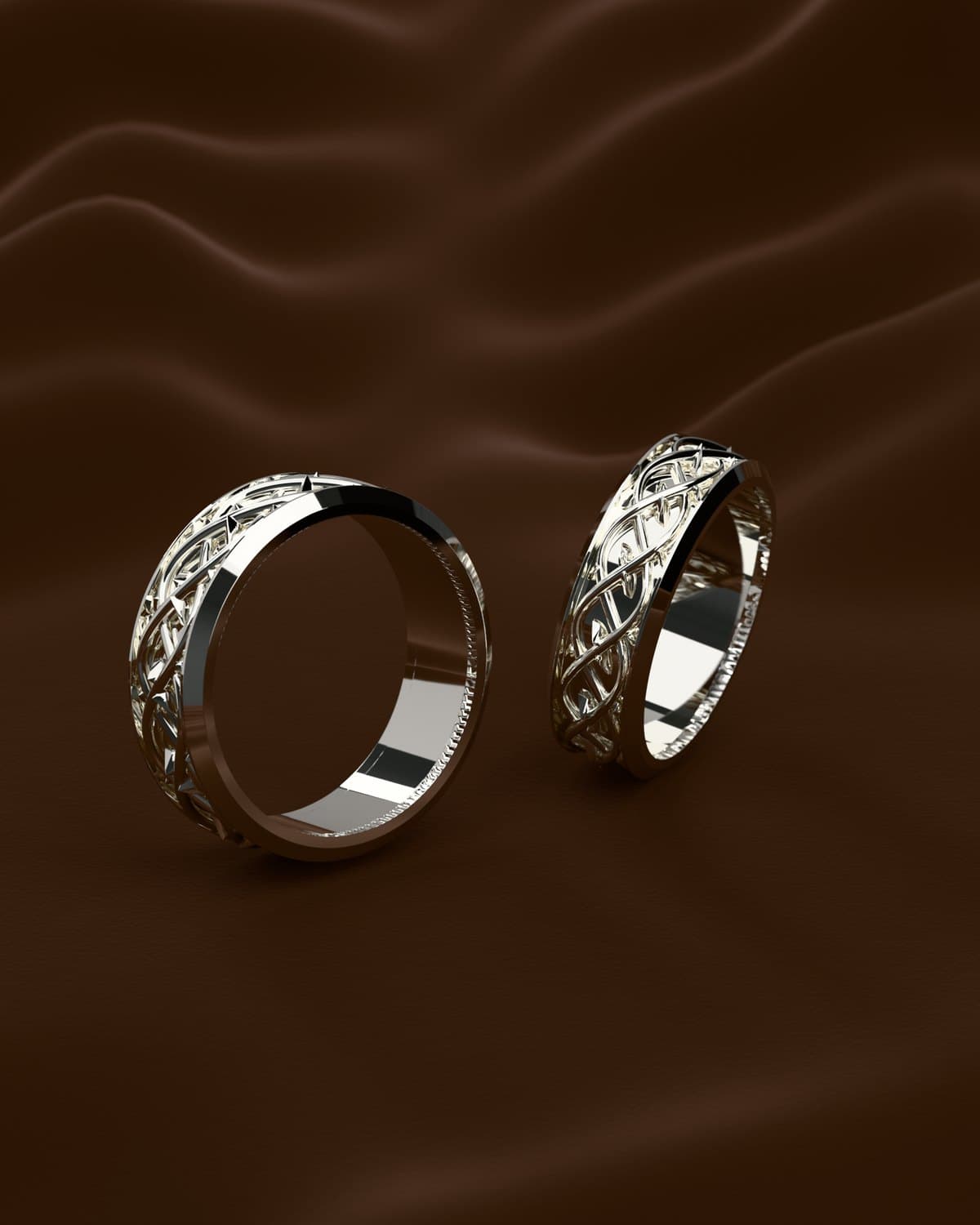 Render de un par de argollas en plata 925 con un tejido calado entre dos bordes lisos, sobre terciopelo café