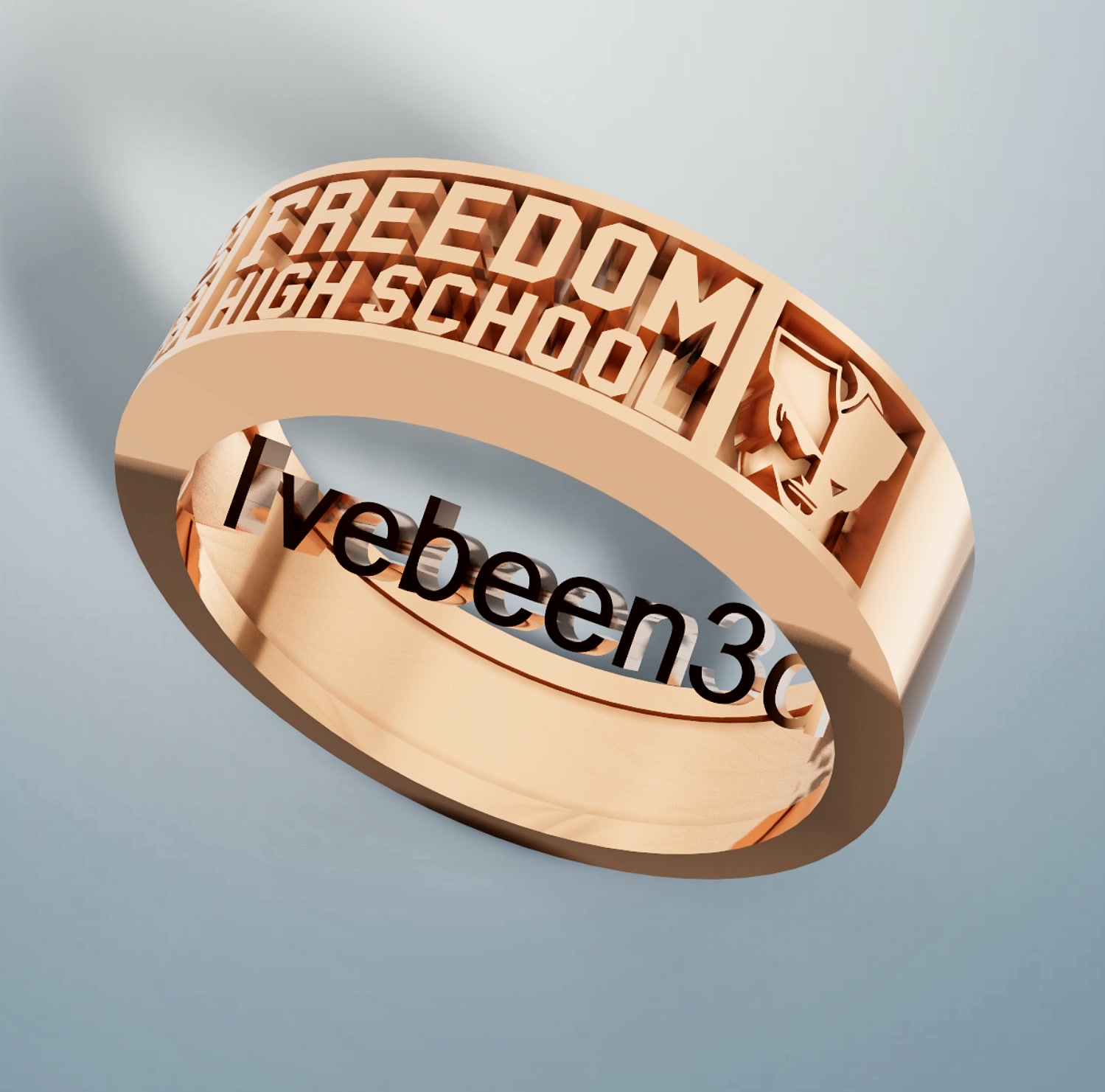 Class ring with school lettering and mascot panel in rose gold