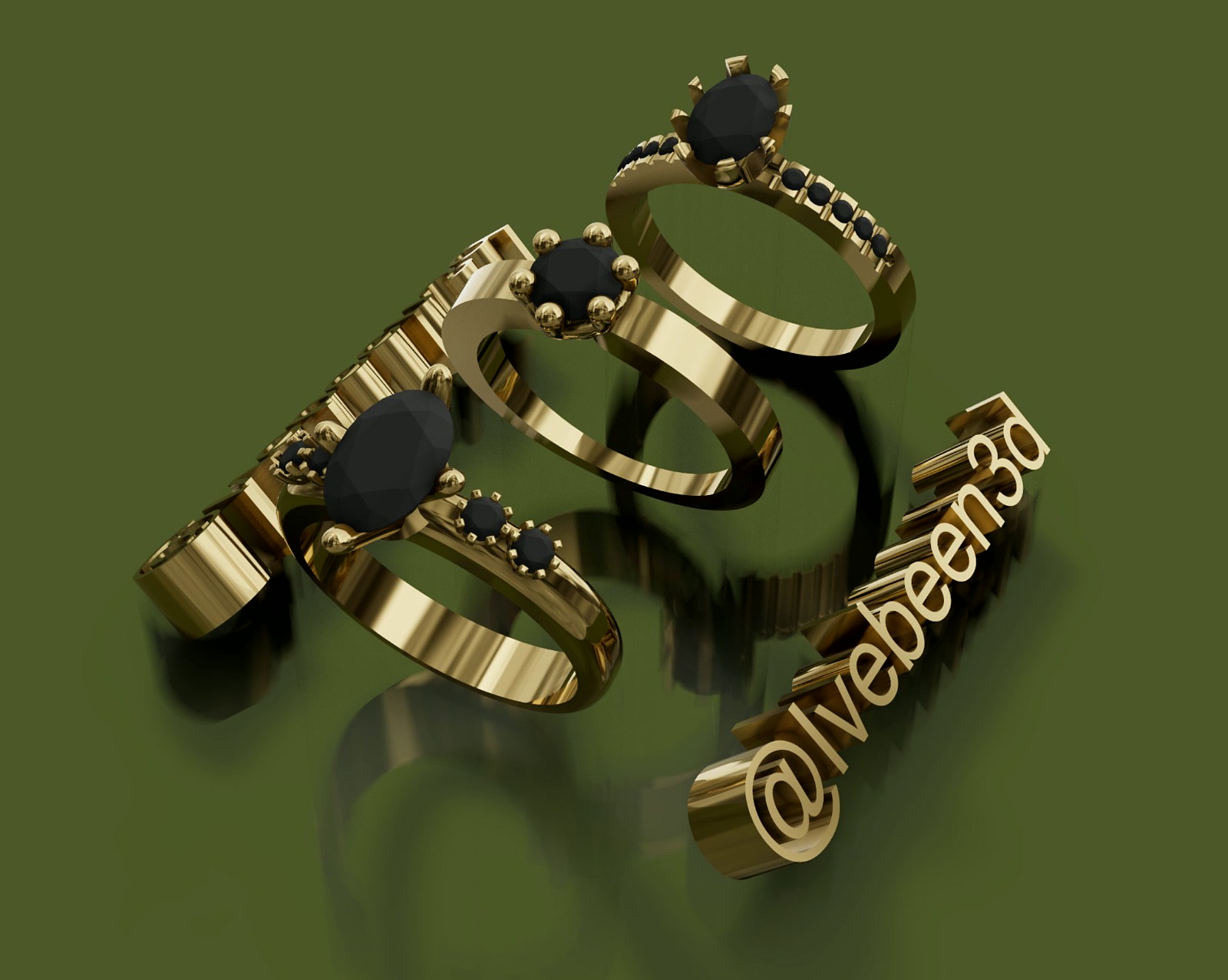 Three yellow gold rings with black stones and pavé band