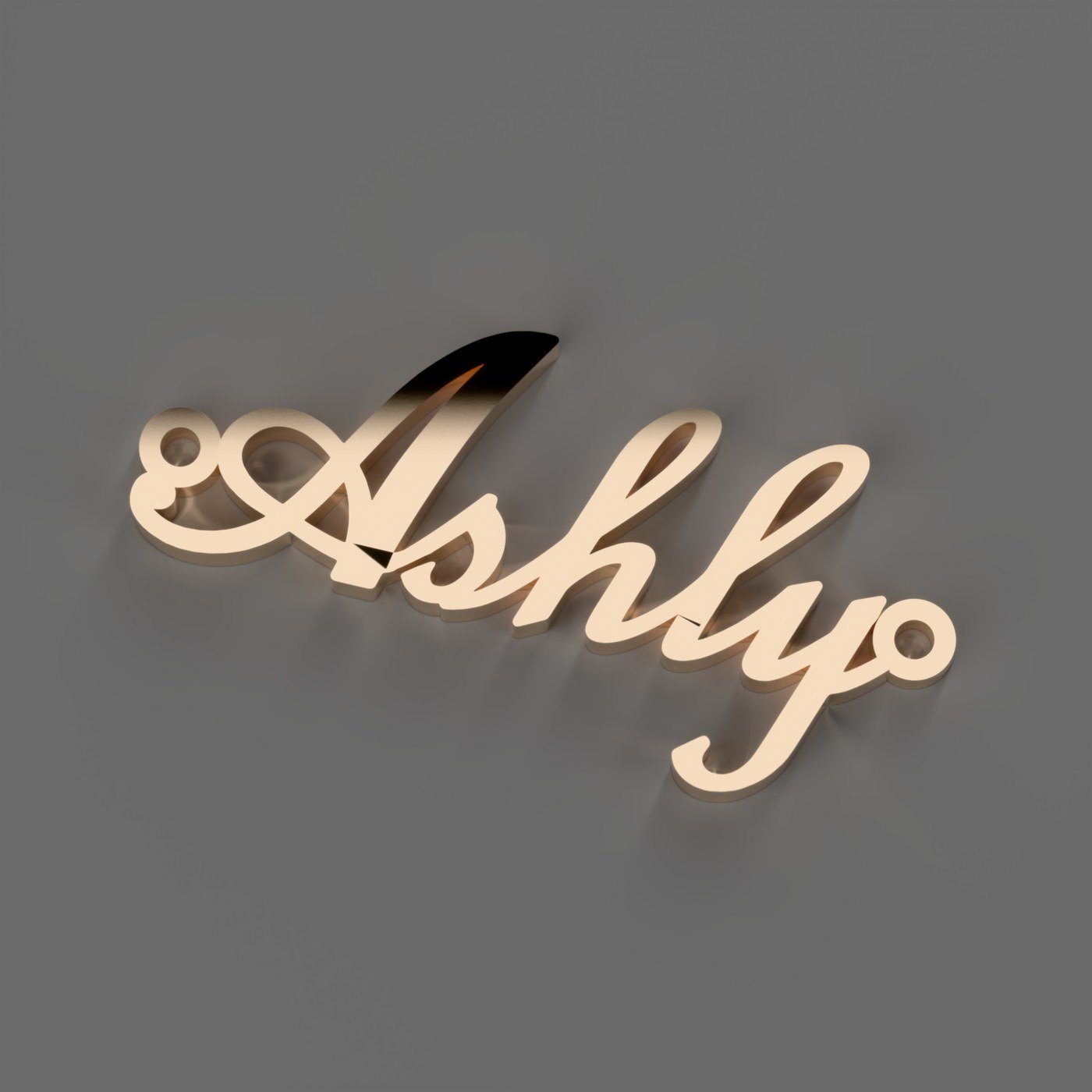 Dije con el nombre Ashly en letra cursiva, en oro rosa de 18 k